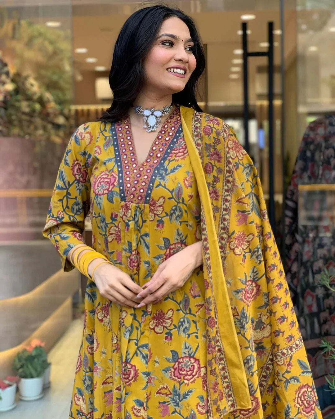 Yellow floral printed cotton suit set with mulmul dupatta